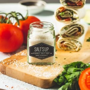 tesco garlic pepper bottle on brown wooden chopping board