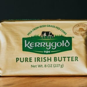 a bar of butter sitting on top of a wooden table
